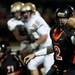 Tecumseh High School senior quarterback Ben Dreslinski pitches the ball in the first half Friday night. Tecumseh won 27-20. Daniel Brenner I AnnArbor.com